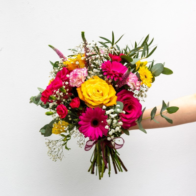 Abigail - Our hand-tied bouquet 'Abigail' meaning "Fountain of joy" or "Father's delight" is a joyful selection of beautiful bright pink and yellow flowers designed by our team to bring joy and delight! Pictured we have stunning cerise roses, germini and carnations with cheerful yellow roses.