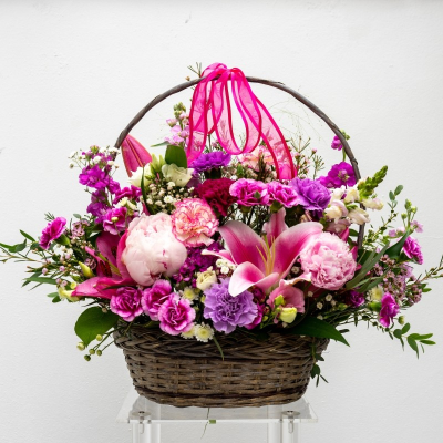 Hannah - Hannah means 'Gift' which perfectly sums up this gorgeous basket arrangement. A stunning centrepiece display packed with gorgeous seasonal blooms. Arranged in oasis so no need to change water or trim stems.
