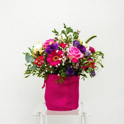 Handful of Happiness - A stunning floral arrangement in a cute pink co ordinating woven bag.