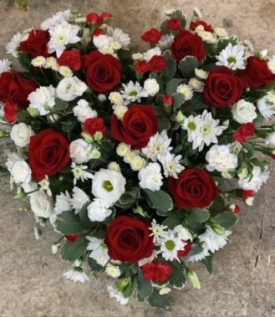 Red and white heart tribute - Reds and whites funeral/grave heart tribute with beautiful fresh blooms such as big headed red roses, lisianthks, chrysanthemums and spray carnations.