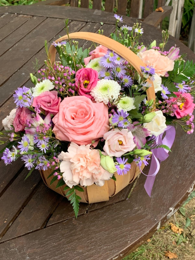 Pastels basket arrangement - A stunning all pastels basket arrangement made into wet oasis suitable for any occasion.